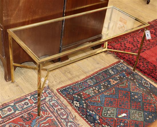 A rectangular glass and brass coffee table W.102cm
